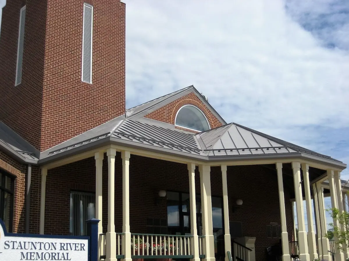 Skilled roofing craftsmen working on a residential roof in Charlestown